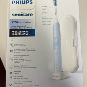 Brand new Adult Phillips Sonicare electric toothbrush in blue